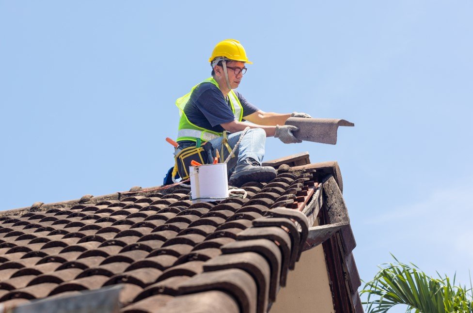 roofer repairing roof